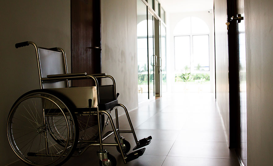 empty wheelchair in nursing home