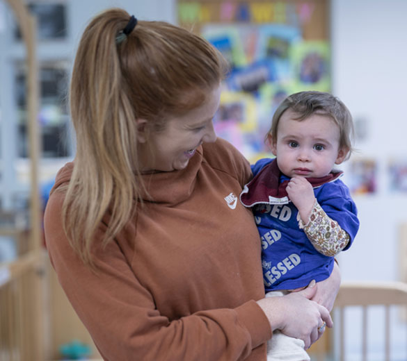 teacher holding baby